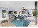 Enclosed patio with dining table and ceiling fan, perfect for entertaining or relaxing at 330 Weber Ter, Port Charlotte, FL 33952