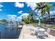 Outdoor dock featuring a patio and seating, perfect for enjoying waterfront views at 330 Weber Ter, Port Charlotte, FL 33952