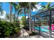 Landscaped backyard with path to pool at 330 Weber Ter, Port Charlotte, FL 33952