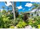 Exterior garden with tropical plants and vibrant flowers at 330 Weber Ter, Port Charlotte, FL 33952