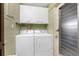 Laundry room with a washer, dryer, and door to the outside at 330 Weber Ter, Port Charlotte, FL 33952