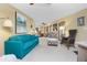 Spacious living room with open floor plan and bright turquoise sofa at 330 Weber Ter, Port Charlotte, FL 33952