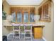Bright office with built-in desk, shuttered windows, and stylish decor at 330 Weber Ter, Port Charlotte, FL 33952