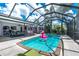 Enclosed pool featuring a patio area, blue water, and clear roof for sunny days at 330 Weber Ter, Port Charlotte, FL 33952