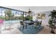 Dining area in sunroom with a view of the pool and the outdoors at 330 Weber Ter, Port Charlotte, FL 33952