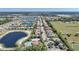 An aerial view of a residential neighborhood with many homes, multiple ponds, and green spaces in Florida at 3631 Pebble Ter, Punta Gorda, FL 33980