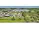 An aerial view of a residential community in Florida with single Gathering homes and apartment buildings at 3631 Pebble Ter, Punta Gorda, FL 33980