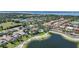 An aerial view of a residential community in Florida with ponds, single Gathering homes, and condo buildings at 3631 Pebble Ter, Punta Gorda, FL 33980