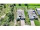 An aerial view of a single Gathering home with a fenced yard, paver driveway, and an attached two car garage at 3631 Pebble Ter, Punta Gorda, FL 33980