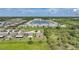 New homes surround a scenic lake in this beautiful aerial view of a residential Florida community at 3631 Pebble Ter, Punta Gorda, FL 33980