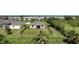 A backyard with a black fence enclosing a green lawn and view of the rear of the house at 3631 Pebble Ter, Punta Gorda, FL 33980