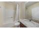 Well-lit bathroom featuring a shower/tub combo, granite countertops, and a mirrored wall cabinet at 3631 Pebble Ter, Punta Gorda, FL 33980