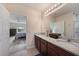 Bathroom with double vanity and granite countertop, connecting to the bedroom at 3631 Pebble Ter, Punta Gorda, FL 33980