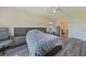 Bright bedroom features wood-look flooring, a large bed and neutral color scheme at 3631 Pebble Ter, Punta Gorda, FL 33980