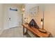 Inviting foyer with a decorative table, tile flooring, and neutral wall colors at 3631 Pebble Ter, Punta Gorda, FL 33980