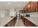 Kitchen with stainless steel appliances, granite countertops, and breakfast bar seating at 3631 Pebble Ter, Punta Gorda, FL 33980