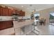 Well-equipped kitchen with stainless steel appliances, granite countertops, and a large center island at 3631 Pebble Ter, Punta Gorda, FL 33980