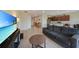 Inviting living room flows into the kitchen and features a comfortable sofa and stylish decor at 3631 Pebble Ter, Punta Gorda, FL 33980