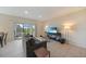Comfortable living room with slider to the lanai and views of the yard at 3631 Pebble Ter, Punta Gorda, FL 33980