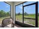 Cozy screened-in patio area with relaxing seating and a view of the spacious fenced backyard at 3631 Pebble Ter, Punta Gorda, FL 33980