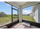 Relaxing screened-in patio with brick floors offering serene backyard views at 3631 Pebble Ter, Punta Gorda, FL 33980