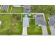 This high angle aerial photo shows the home's metal workshop, pool and surrounding property at 369 Hyacinth St, Port Charlotte, FL 33954