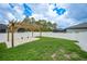 Landscaped backyard with a pergola, offering a great space for relaxation and gatherings at 369 Hyacinth St, Port Charlotte, FL 33954