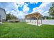 Spacious backyard featuring a wooden pergola, perfect for outdoor entertaining at 369 Hyacinth St, Port Charlotte, FL 33954
