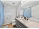 Bathroom with a white marble vanity, modern sink, and a large mirror at 369 Hyacinth St, Port Charlotte, FL 33954