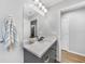 Bathroom with a white marble vanity, modern sink, and a large mirror at 369 Hyacinth St, Port Charlotte, FL 33954