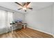 Bright bedroom featuring hardwood floors, a ceiling fan, and neutral paint at 369 Hyacinth St, Port Charlotte, FL 33954