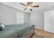 Bedroom featuring hardwood floors, a ceiling fan, and neutral paint at 369 Hyacinth St, Port Charlotte, FL 33954