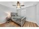 Bright bedroom featuring hardwood floors, a ceiling fan, and neutral paint at 369 Hyacinth St, Port Charlotte, FL 33954