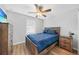 Comfortable bedroom featuring a wood bed frame and matching nightstand and dresser at 369 Hyacinth St, Port Charlotte, FL 33954