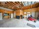 View of the spacious garage including a television and lawn mower, great for projects and storage at 369 Hyacinth St, Port Charlotte, FL 33954