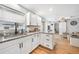 Bright kitchen featuring white cabinets, granite countertops, and a sink with backyard views at 369 Hyacinth St, Port Charlotte, FL 33954