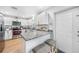 Charming kitchen featuring white cabinets, granite countertops, stainless appliances, and breakfast bar seating at 369 Hyacinth St, Port Charlotte, FL 33954