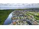Beautiful aerial view of a waterfront community with lush landscaping, boat docks, and stunning views at 3800 Carupano Ct, Punta Gorda, FL 33950