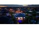 Aerial view of home at dusk featuring an outdoor pool, waterfront view, and rooftop at 3800 Carupano Ct, Punta Gorda, FL 33950
