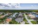 Picturesque aerial view of waterfront homes along a canal, showcasing lush landscaping and boat docks at 3800 Carupano Ct, Punta Gorda, FL 33950