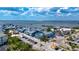 Aerial view showcasing waterfront condo buildings, boat docks, and parking areas at 3800 Carupano Ct, Punta Gorda, FL 33950