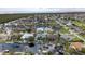 Scenic aerial view of waterfront homes lining a canal with lush greenery and private boat docks in a community at 3800 Carupano Ct, Punta Gorda, FL 33950
