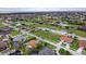 Expansive aerial view showcasing a residential community with lush greenery, ponds, and access to waterfront living at 3800 Carupano Ct, Punta Gorda, FL 33950