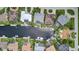 Aerial view of waterfront homes lining a canal with private boat docks and stunning architectural designs at 3800 Carupano Ct, Punta Gorda, FL 33950