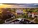 Stunning aerial view of a waterfront home with a screened-in pool, boat dock, and lush landscaping at 3800 Carupano Ct, Punta Gorda, FL 33950