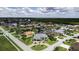 Expansive aerial view of waterfront homes with lush landscaping and private boat docks along a scenic canal at 3800 Carupano Ct, Punta Gorda, FL 33950