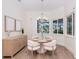 Cozy dining room with natural light, a round table, and a sideboard at 3800 Carupano Ct, Punta Gorda, FL 33950