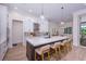 Kitchen features a large island with counter seating and modern appliances at 3800 Carupano Ct, Punta Gorda, FL 33950