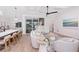Open concept living room with a kitchen island and access to the backyard at 3800 Carupano Ct, Punta Gorda, FL 33950