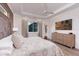 Relaxing main bedroom featuring a tray ceiling, large dresser, and neutral decor at 3800 Carupano Ct, Punta Gorda, FL 33950